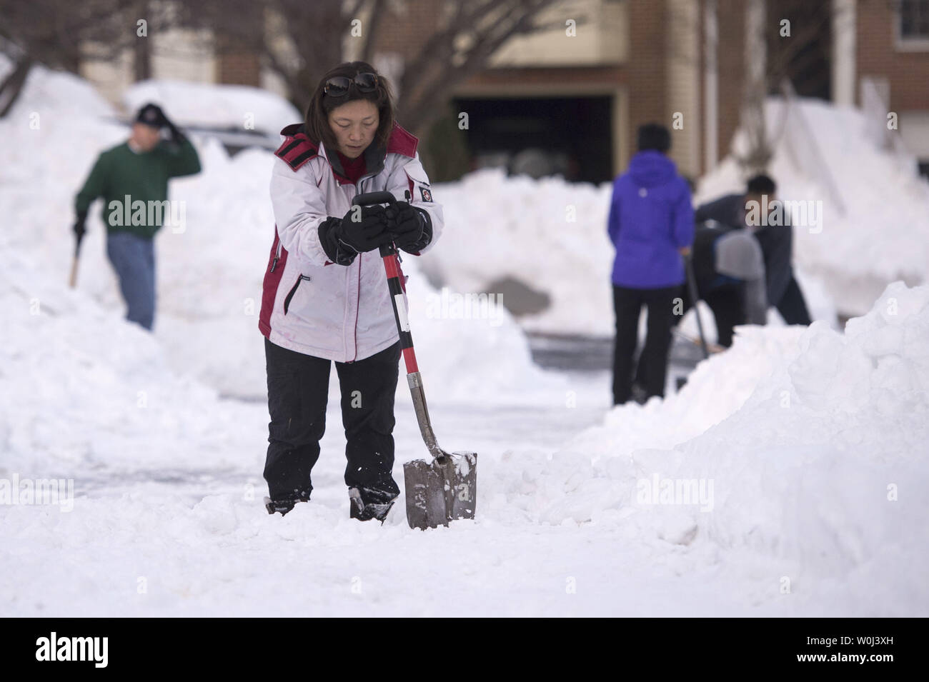 People continue to clean-up following the past weekend's blizzard, in Centreville, Virginia on January 25, 2016. A deadly nor'easter blizzard blanketed parts of the east coast bringing near-record amounts of snow, shutting down Washington, Philadelphia and New York city. Photo by Kevin Dietsch/UPI Stock Photo