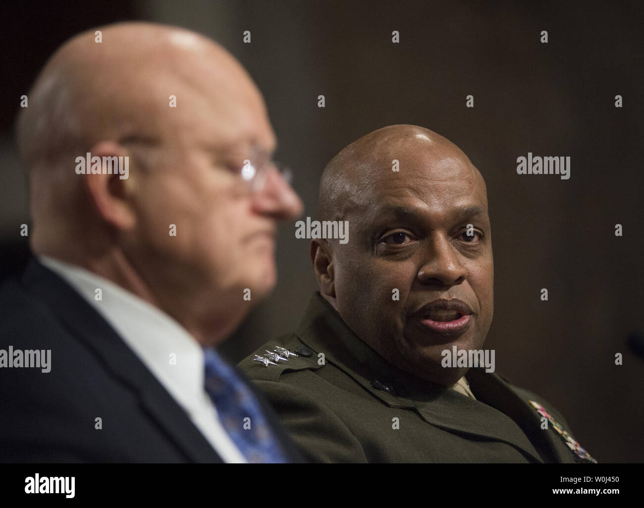 Marine Corps Lt. Gen. Vincent Stewart, right, director of the Defense Intelligence Agency, testifies next to Director of National Intelligence James Clapper during the Senate Armed Services Committee hearing on 'worldwide threats,' on Capitol Hill in Washington DC, February 9, 2016.  Photo by Molly Riley/UPI Stock Photo