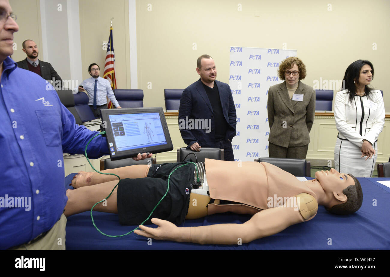 A technician from Canadian Aviation Engineering (CAE) Health Care holds a monitor attached to a human simulator for a demonstration on using simulators instead of animals in teaching battlefield trauma to medical personnel, during a briefing, February 10, 2016, on Capitol Hill,  in Washington, DC. A bill is before Congress proposing cost savings by using the technology and sparing animals, which is supported by People for the Ethical Treatment of Animals (PETA).     Photo by Mike Theiler/UPI Stock Photo