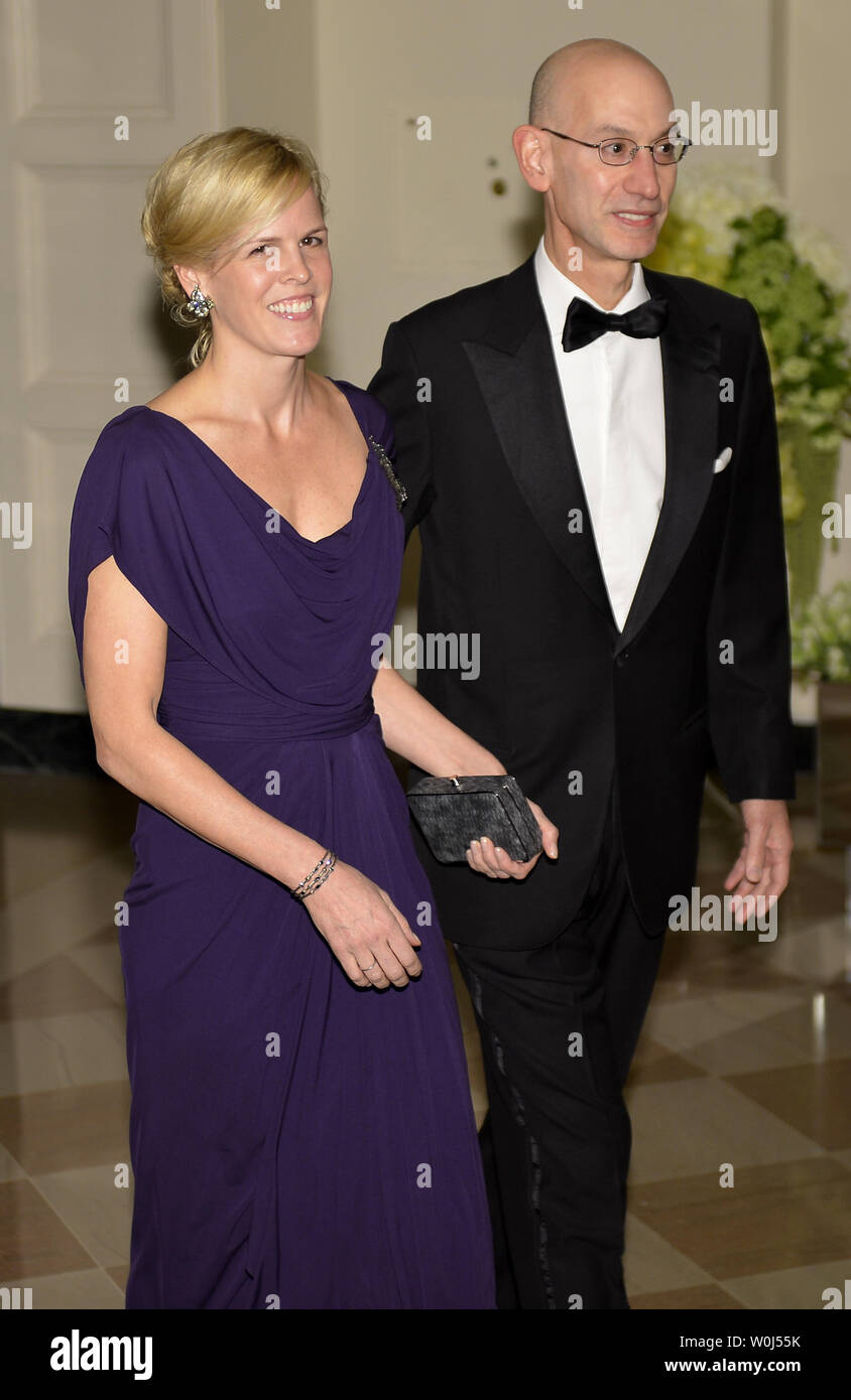 National Basketball Association Commissioner Adam Silver (R) and interior  designer Maggie Grise arrive at the White House for the State Dinner for  Canada's Prime Minister Justin Trudeau and First Lady Sophie Gregorie