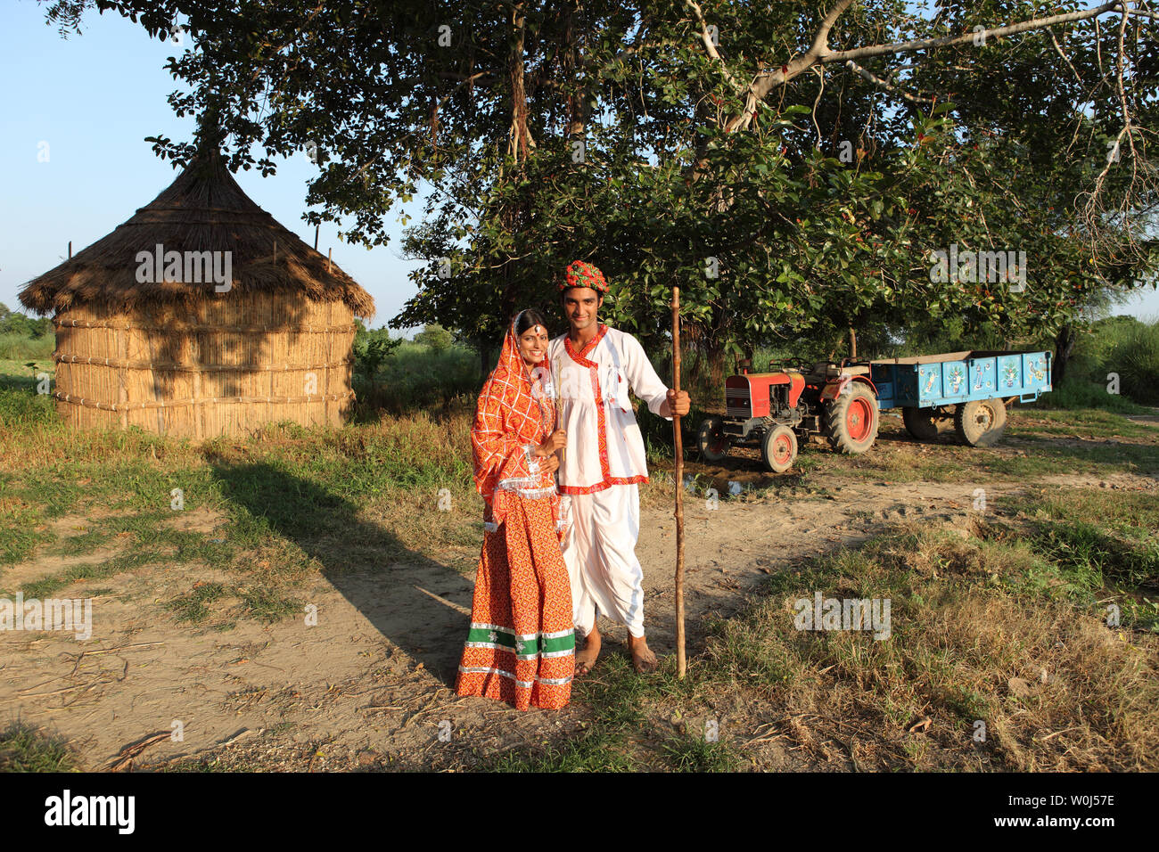 Farmer standing with his wife in a field Stock Photo - Alamy