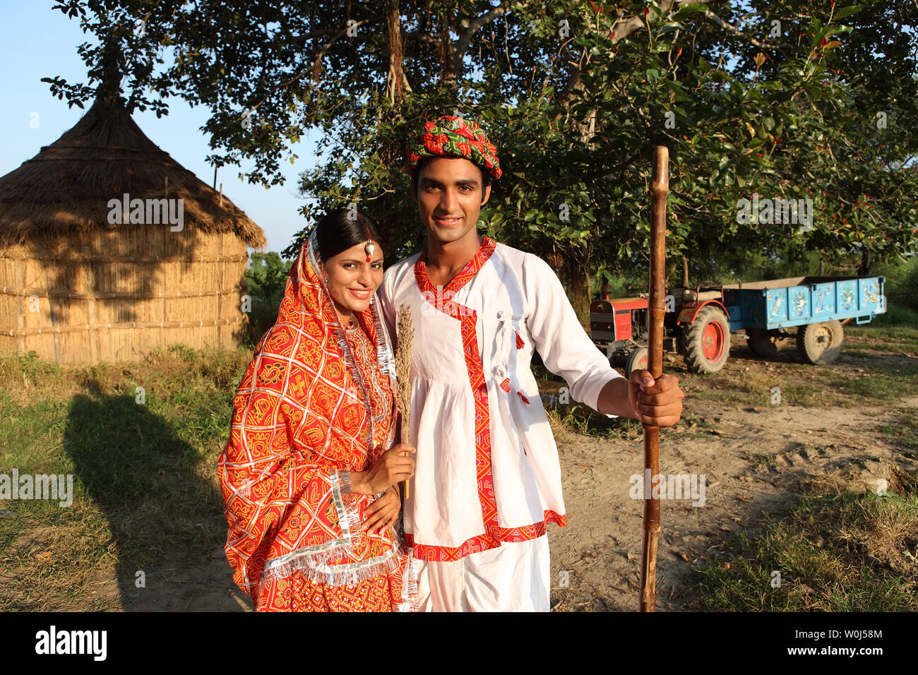 Farmer standing with his wife in a field Stock Photo - Alamy