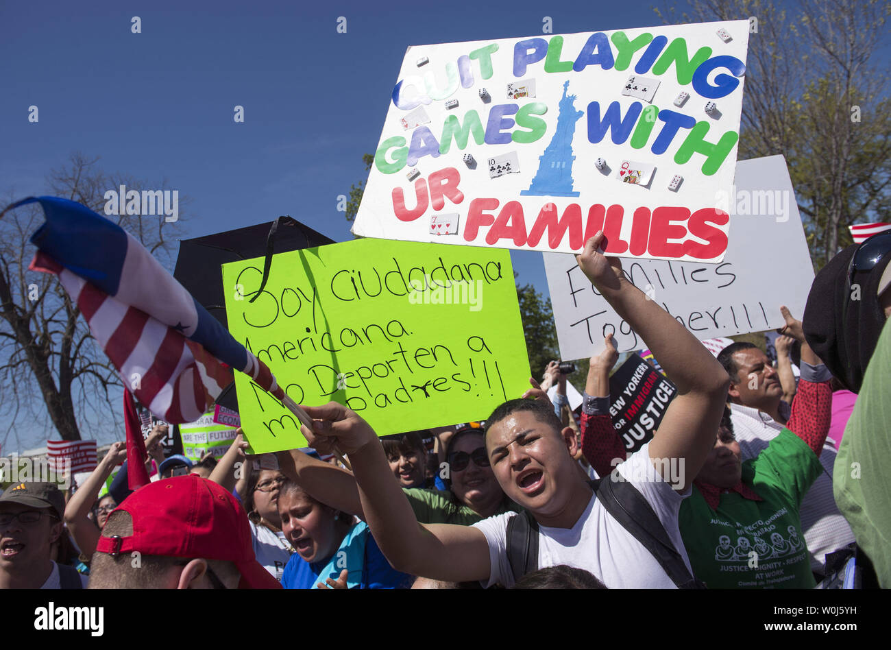 Protesters gather outside of the Supreme Court as the Court hears oral arguments in the case of United States v. Texas, which will consider a legal challenge to the Deferred Action for Parents of Americans (DAPA) program and the expansion of the Deferred Action for Childhood Arrivals (DACA) program, in Washington, D.C. on April 18, 2016. Photo by Kevin Dietsch/UPI Stock Photo