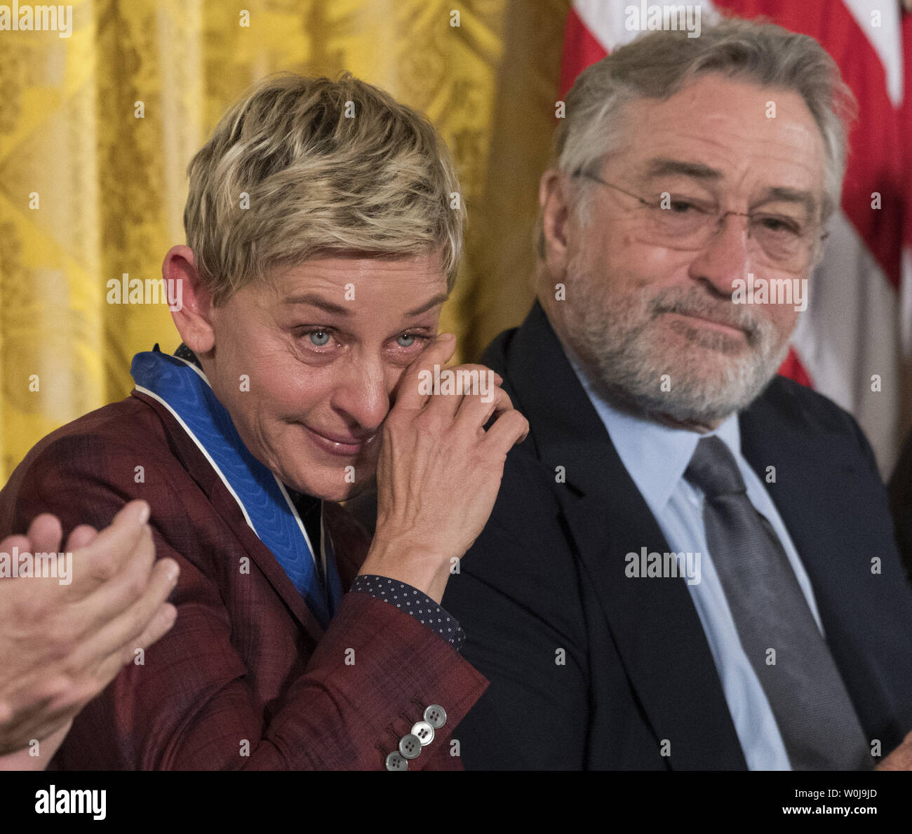 Comedian Ellen DeGeneres sheds a tear after President Barack Obama awarded  her Presidential Medal of Freedom during a ceremony in the East Room at the  White House in Washington, D.C. on November