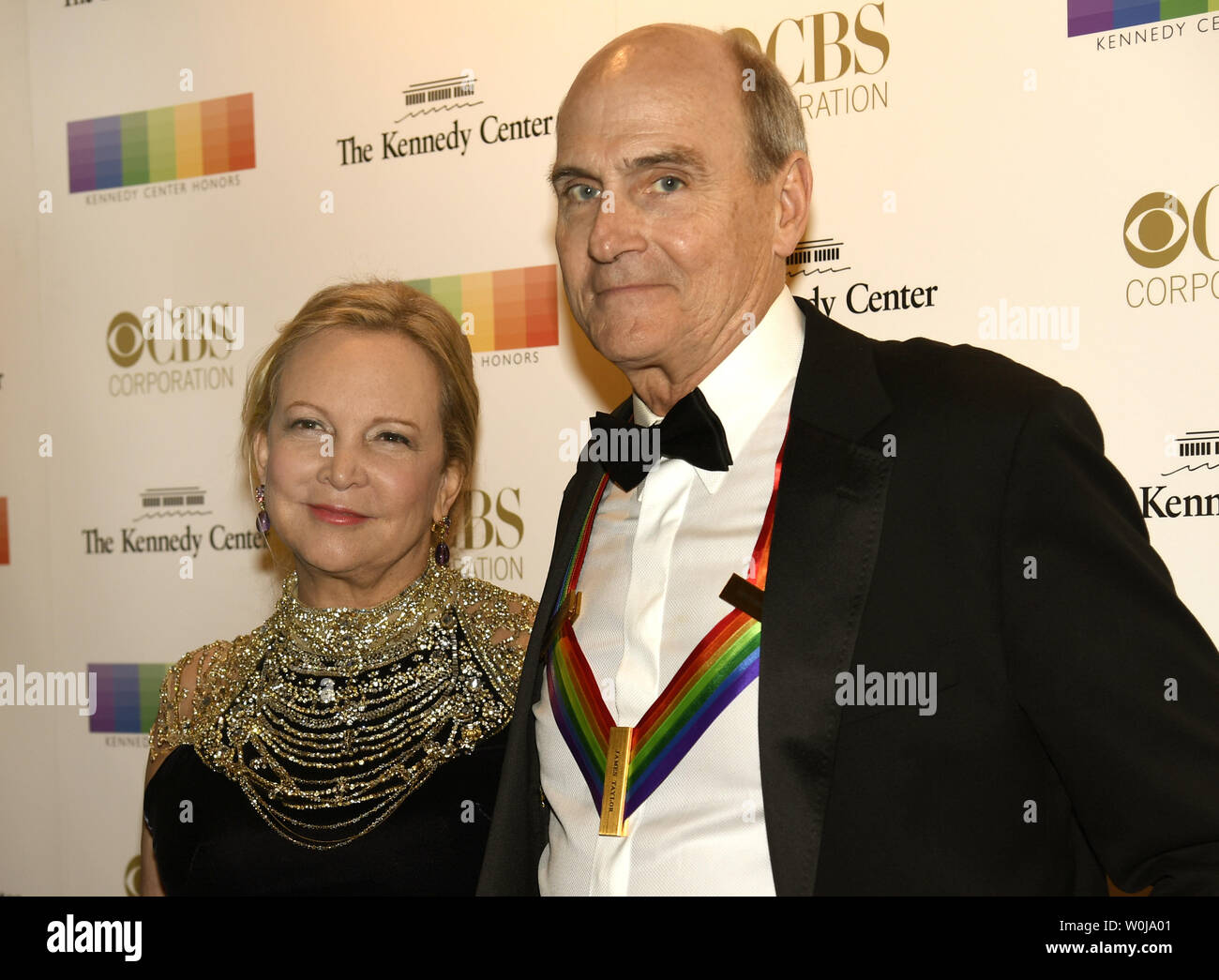 2016 Kennedy Center Honoree singer-songwriter James Taylor and his wife Caroline 'Kim' Smedvig greet photographers as they arrive on the red carpet for an evening of gala entertainment at the Kennedy Center, December 4, 2016, in Washington, DC.  The Honors are bestowed annually on five artists for their lifetime achievement in the arts and culture.    Photo by Mike Theiler/UPI Stock Photo