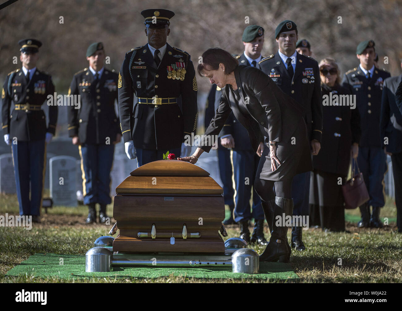 Cynthia Moriarty mourns over the casket continuing the remains of her
