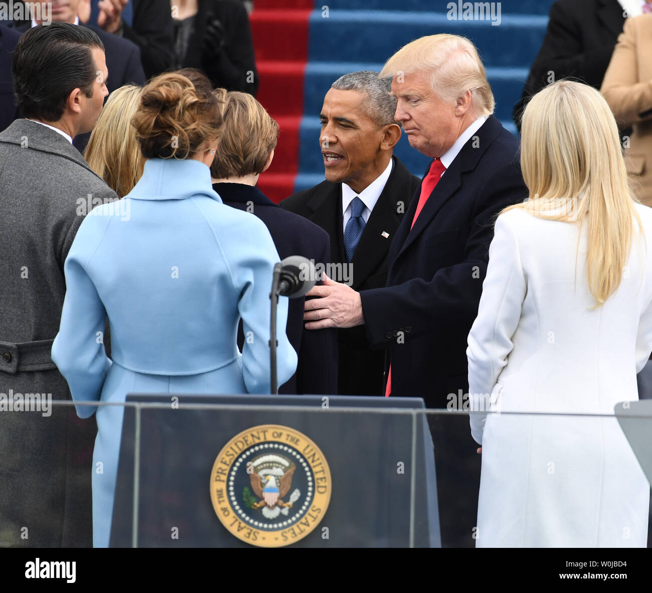 Former President Barack Obama greets President Donald J. Trump and