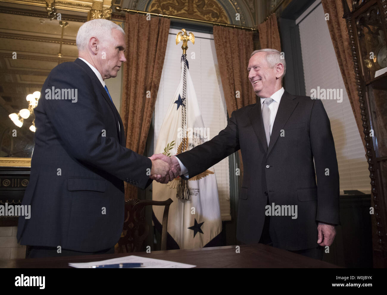 Marine Corps General James Mattis shakes hands with Vice President Mike Pence after being sworn-in as Defense Secretary, in the Vice Presidential ceremonial office in the Executive Office Building in Washington, D.C. on January 20, 2017. Photo by Kevin Dietsch/UPI Stock Photo