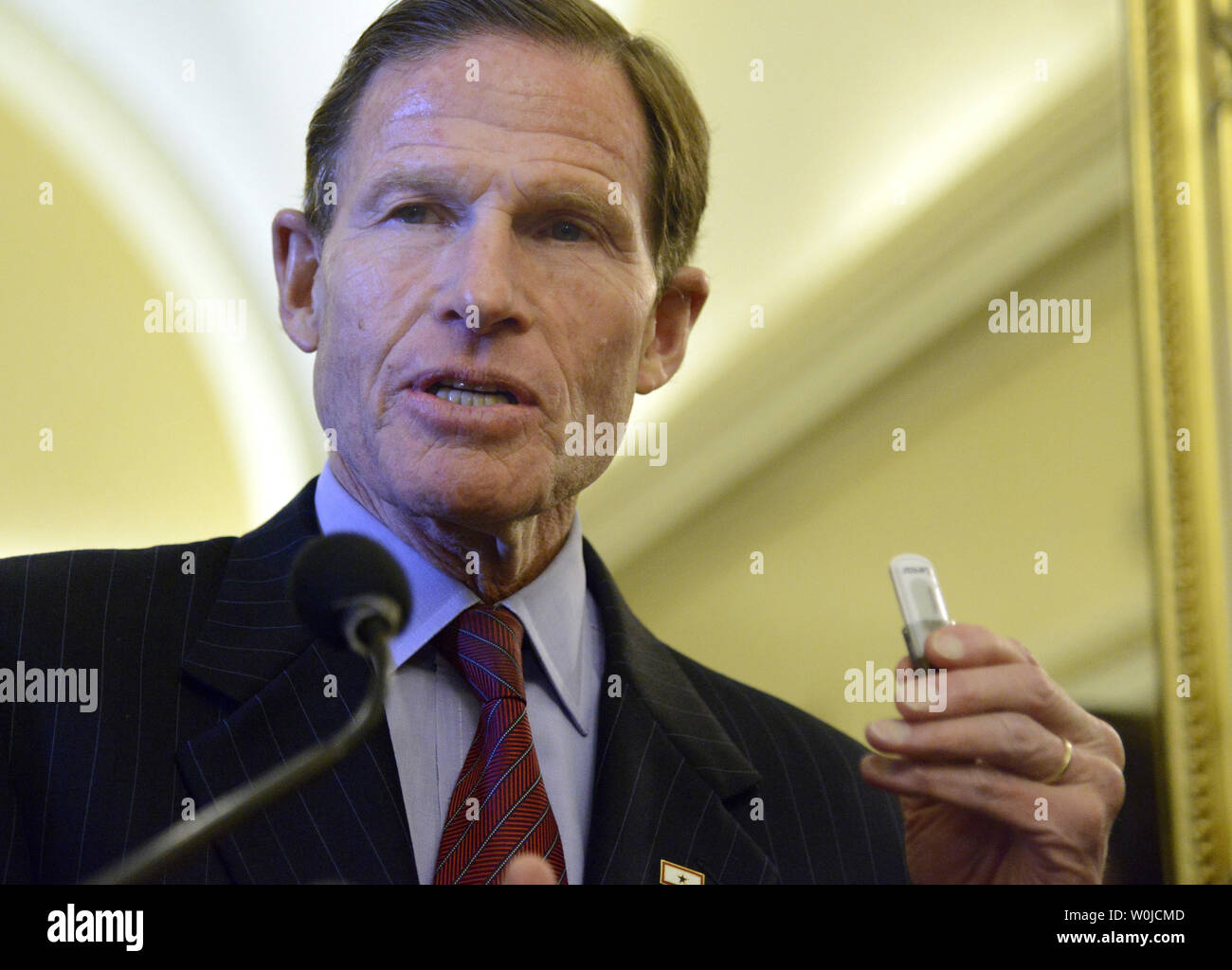 Connecticut Sen. Richard Blumenthal holds a thumb drive ... Connecticut Sen. Richard Blumenthal holds a thumb drive ...