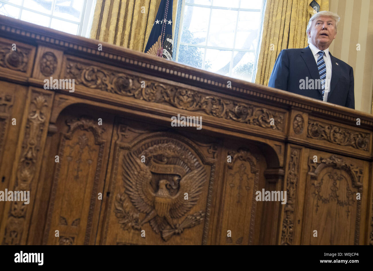 President Donald Trump Is Seen Behind The Resolute Desk In The
