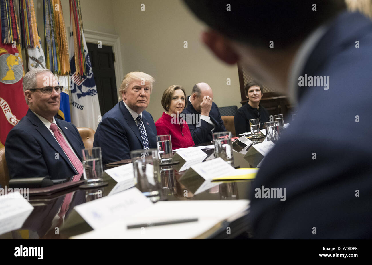 President Donald Trump (2nd-L) holds a National Economic Council listening session with the CEOs of small and community banks, in the Roosevelt Room at the White House in Washington, D.C. on March 9, 2017. Trump was joined by Kenneth Burgess (L), Chairman of the First Capital Bank of Texas; Dorothy Savarese, CEO of Cape Cod Five Mutual Company (C); Gary Cohn, National Economic Council Director; and Leslie Anderson, CEO of Bank of Bennington. Photo by Kevin Dietsch/UPI Stock Photo