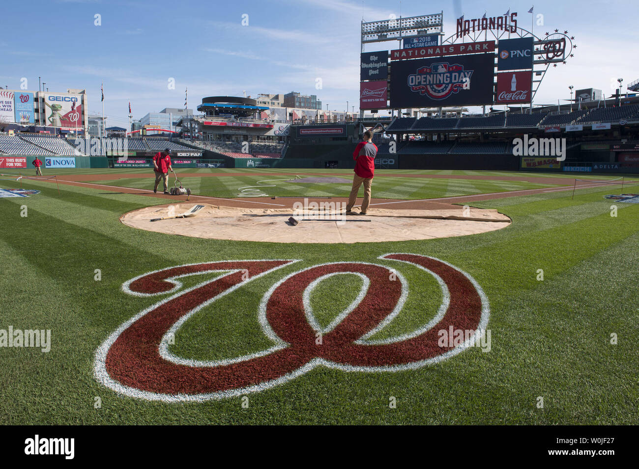 Grounds Crew Paint The Baseline Near Home Plate Prior To The The Washington Nationals Opening Day Game Against The Miami Marlins At Nationals Park In Washington D C On April 3 2017 Photo