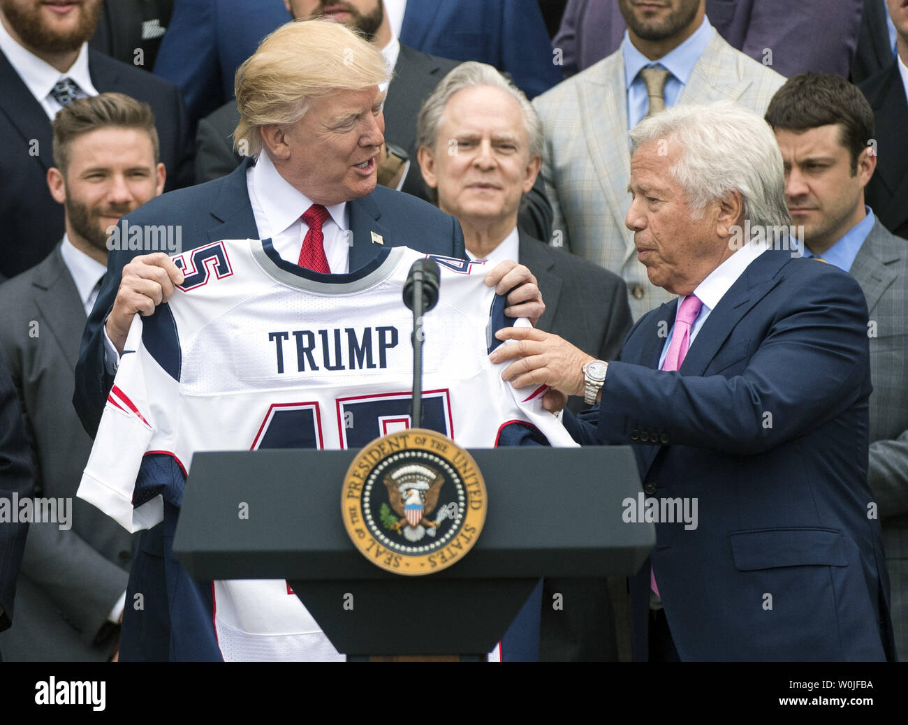 President Donald Trump is presented a custom jersey by New England Patriots  owner Robert Kraft during ceremony where Trump honored the Super Bowl LI  Champions New England Patriots at the White House