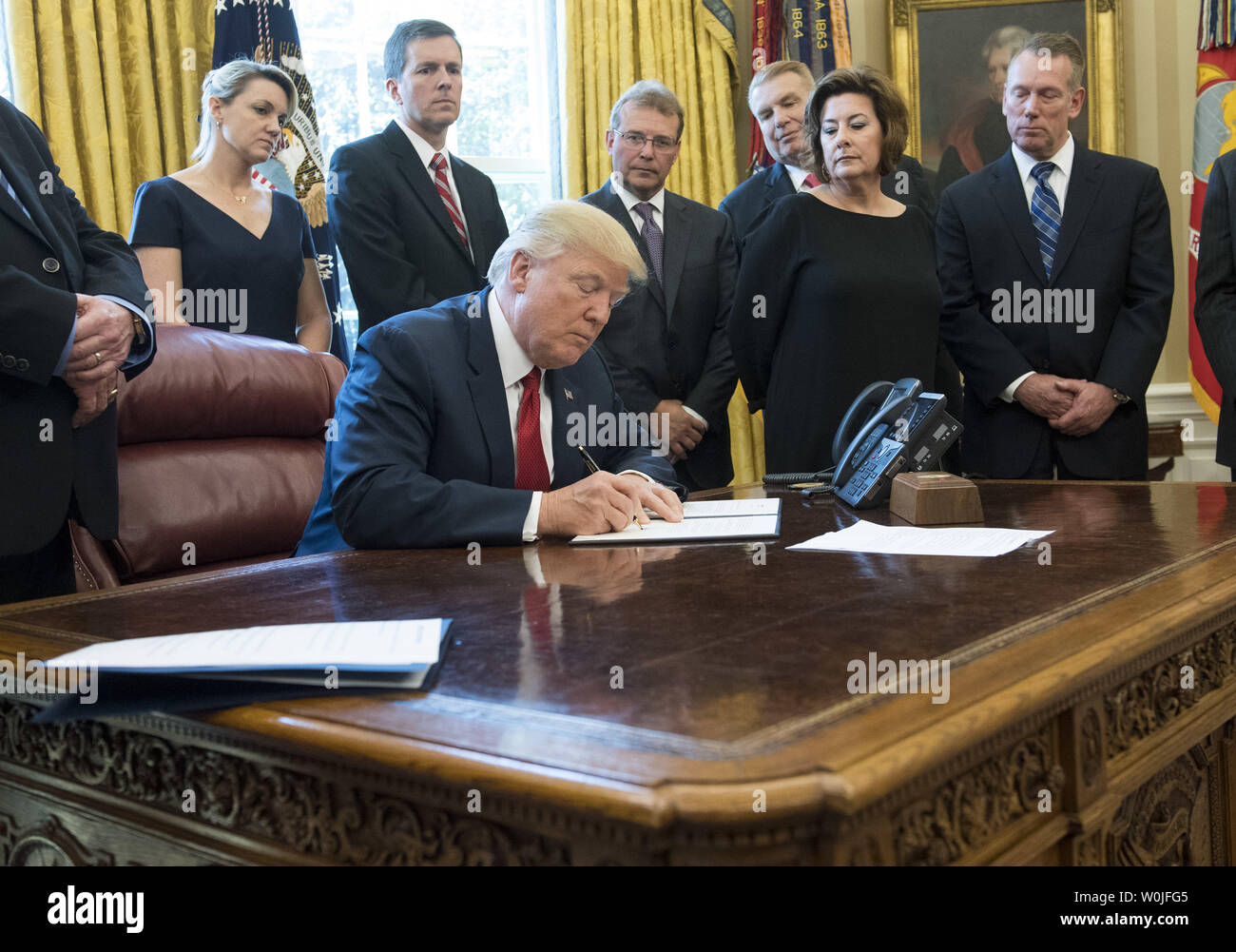 President Donald Trump signs a Memorandum Regarding the Investigation  Pursuant to Section 232(B) of the Trade Expansion Act, during a ceremony in  the Oval Office at the White House in Washington, D.C.