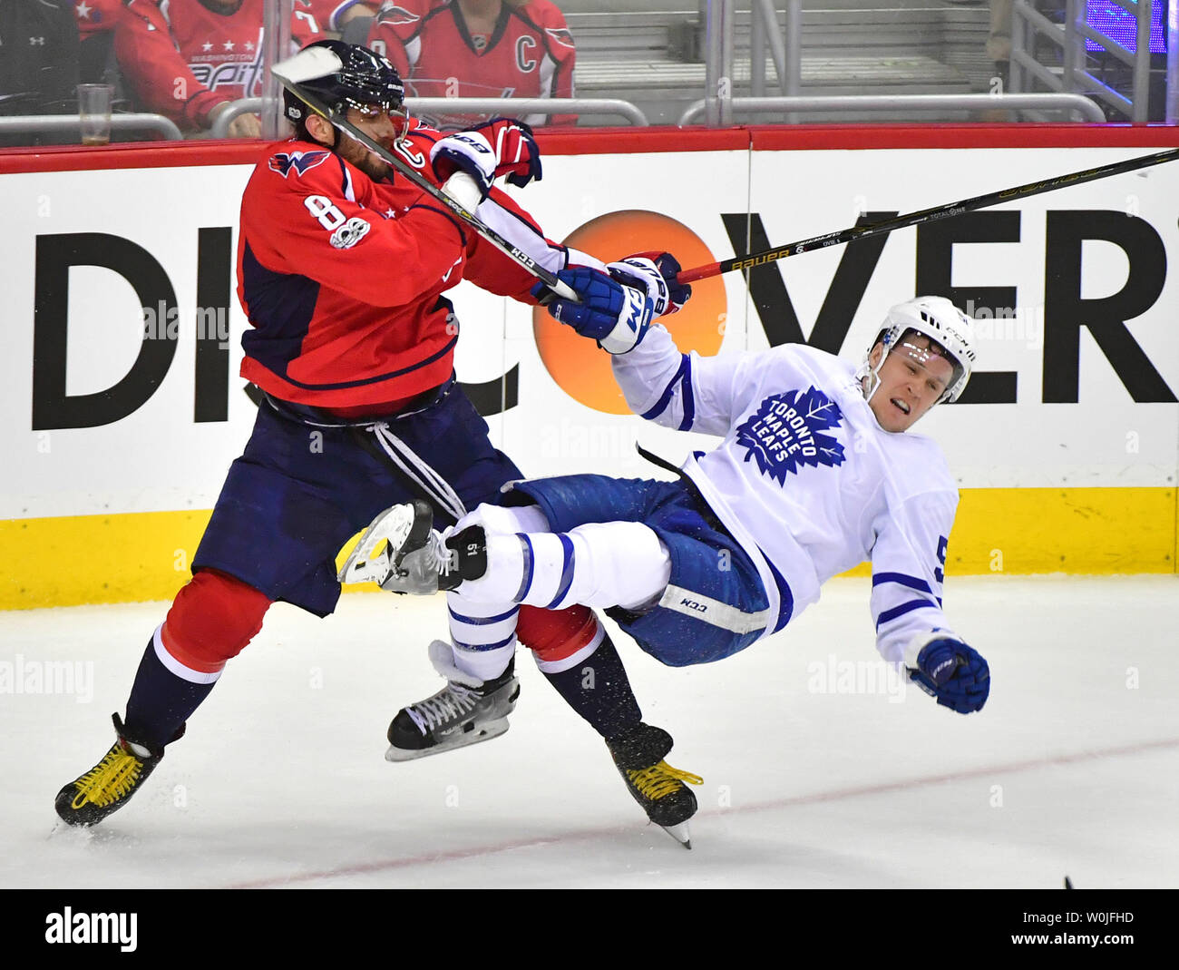 Washington Capitals left wing Alex Ovechkin (8) hits Toronto Maple Leafs  defenseman Jake Gardiner (51) in the first period of game 3 of the Eastern  Conference Quarterfinals at the Verizon Center in