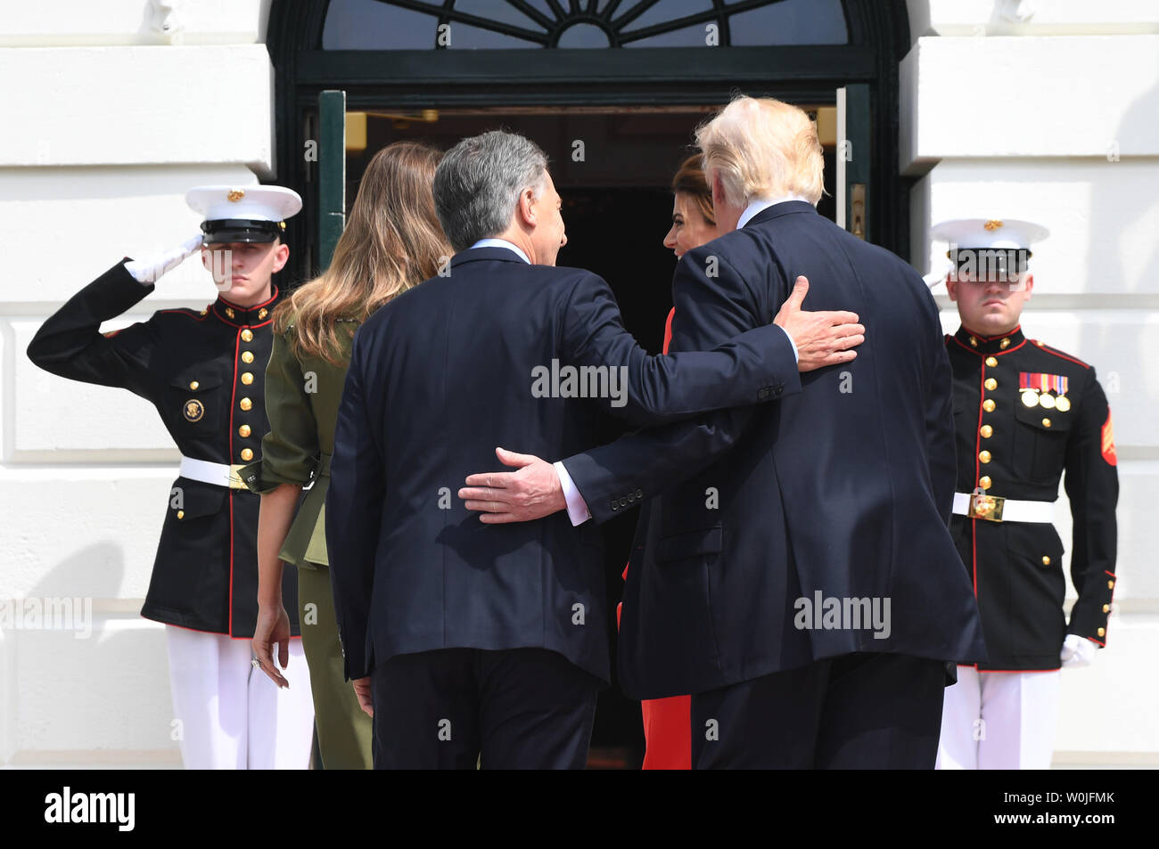 U.S. President Donald Trump and Argentine President Mauricio Macri (L) walk in the White House with their wives First Lady Melania and Juliana Awada (L)) upon arrival at the South Portico of the White House in Washington, DC on April 27, 2017.  Macri is in town for talks with Trump.     Photo by Pat Benic/UPI Stock Photo