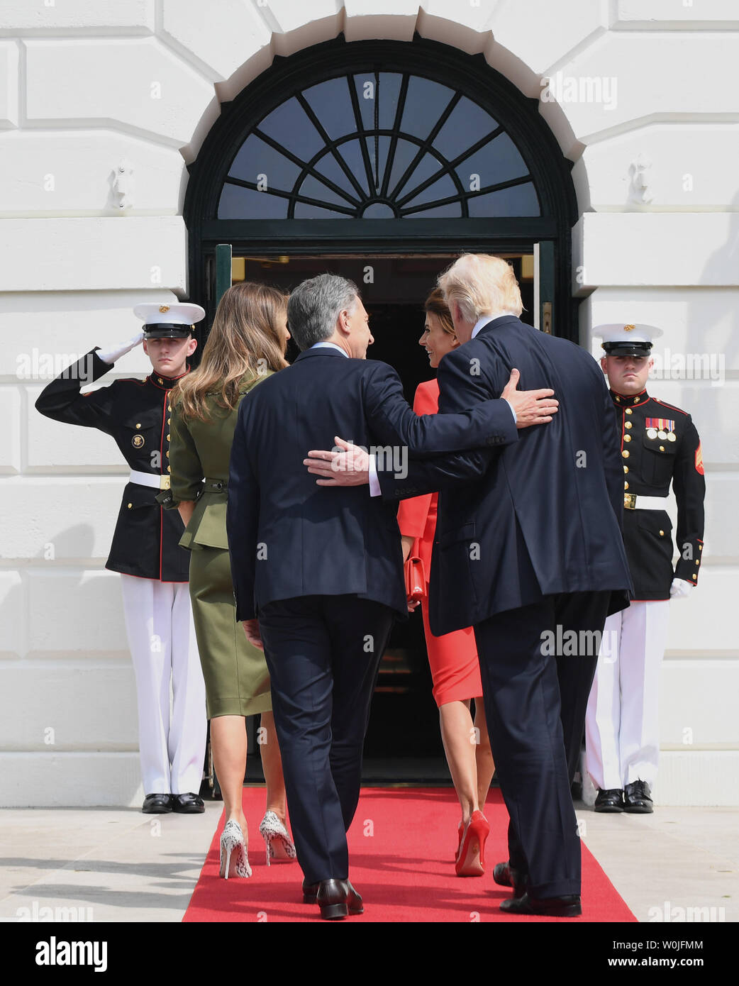 U.S. President Donald Trump and Argentine President Mauricio Macri (L) walk in the White House with their wives First Lady Melania and Juliana Awada (L)) upon arrival at the South Portico of the White House in Washington, DC on April 27, 2017.  Macri is in town for talks with Trump.     Photo by Pat Benic/UPI Stock Photo