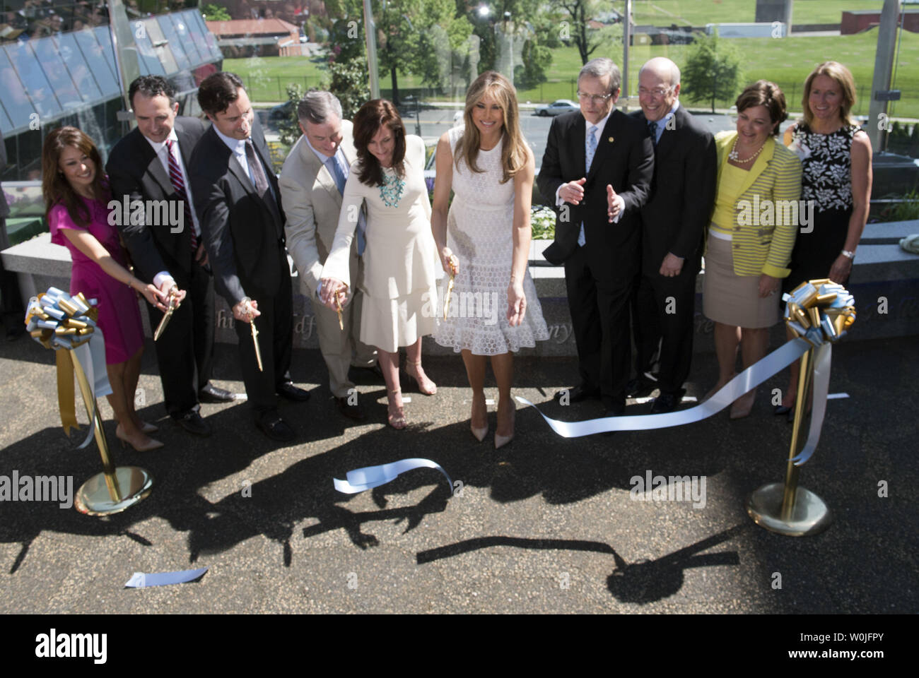 First Lady Melania Trump cuts the ribbon with others as she helps to open the Bunny Mellon Healing Garden, dedicated to the First Ladies of the United States, at Children's National Hospital in Washington, D.C. on April 28, 2017.  The hospital transformed a gravel rooftop into an outdoor garden for patients and their families. Photo by Kevin Dietsch/UPI Stock Photo