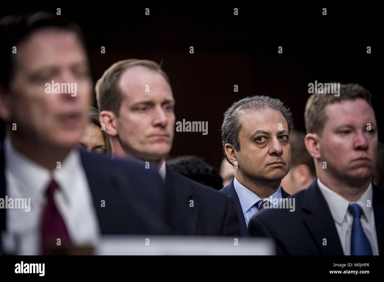Preet Bharara, former U.S. Attorney for the Southern District of New York looks on as former FBI Director James Comey testifies at a hearing of the Senate Select Intelligence Committee on Capitol Hill in Washington, D.C. on June 8, 2017. Comey testified about his interactions with President Donald Trump that included the alleged pressure Comey felt to stop certain investigations regarding Russia and its interference in the presidential election.  Comey was abruptly fired by the president last month.  Photo by Pete Marovich/UPI Stock Photo