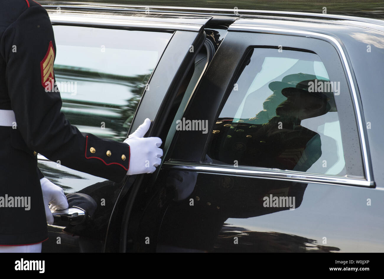 A Marine opens the door of the limousine as South Korean President Moon Jae-in and his wife Kim Jung-sook  arrive at the White House for a dinner with President Donald Trump, in Washington, D.C. on June 29, 2017.  Photo by Kevin Dietsch/UPI Stock Photo