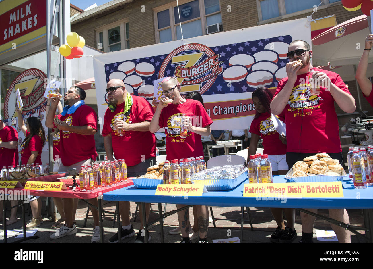 Molly Schuyler (2nd-R), Patrick 'Deep Dish' Bettletti (R), Bob 'Notorious B.O.B. Schoudt (2nd-L) and David 'Tiger Wings and Things' Brunelli compete in the Z-Burger 8th Annual Independence Burger Eating Championship, in Washington D.C. on July 3, 2017. Schuyler won this year's contest eating 21 burgers in 10 minutes. Photo by Kevin Dietsch/UPI Stock Photo