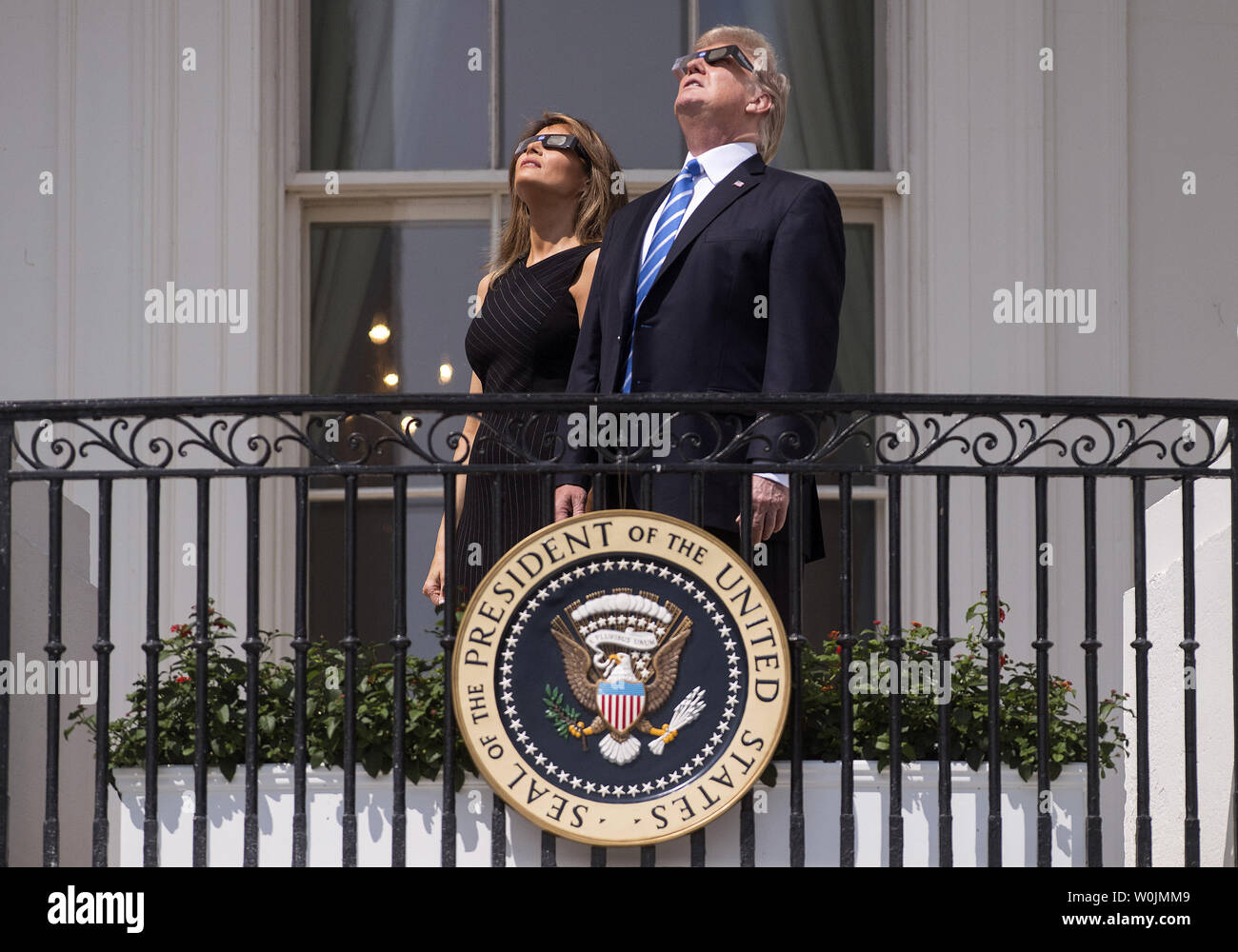President Donald Trump and First Lady Melania trump wear special solar