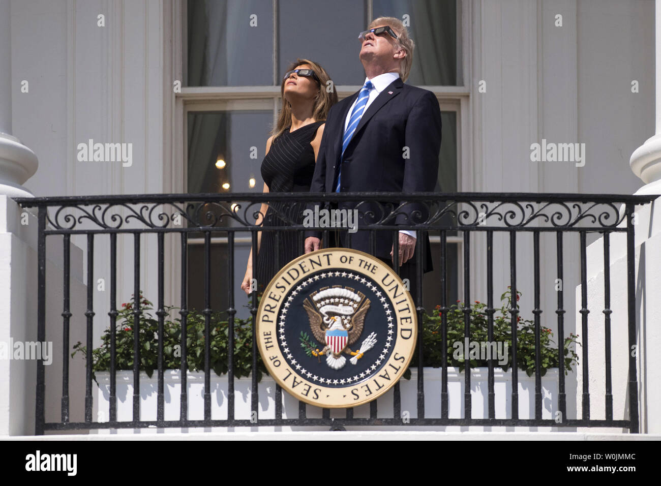 President Donald Trump and First Lady Melania trump wear special solar