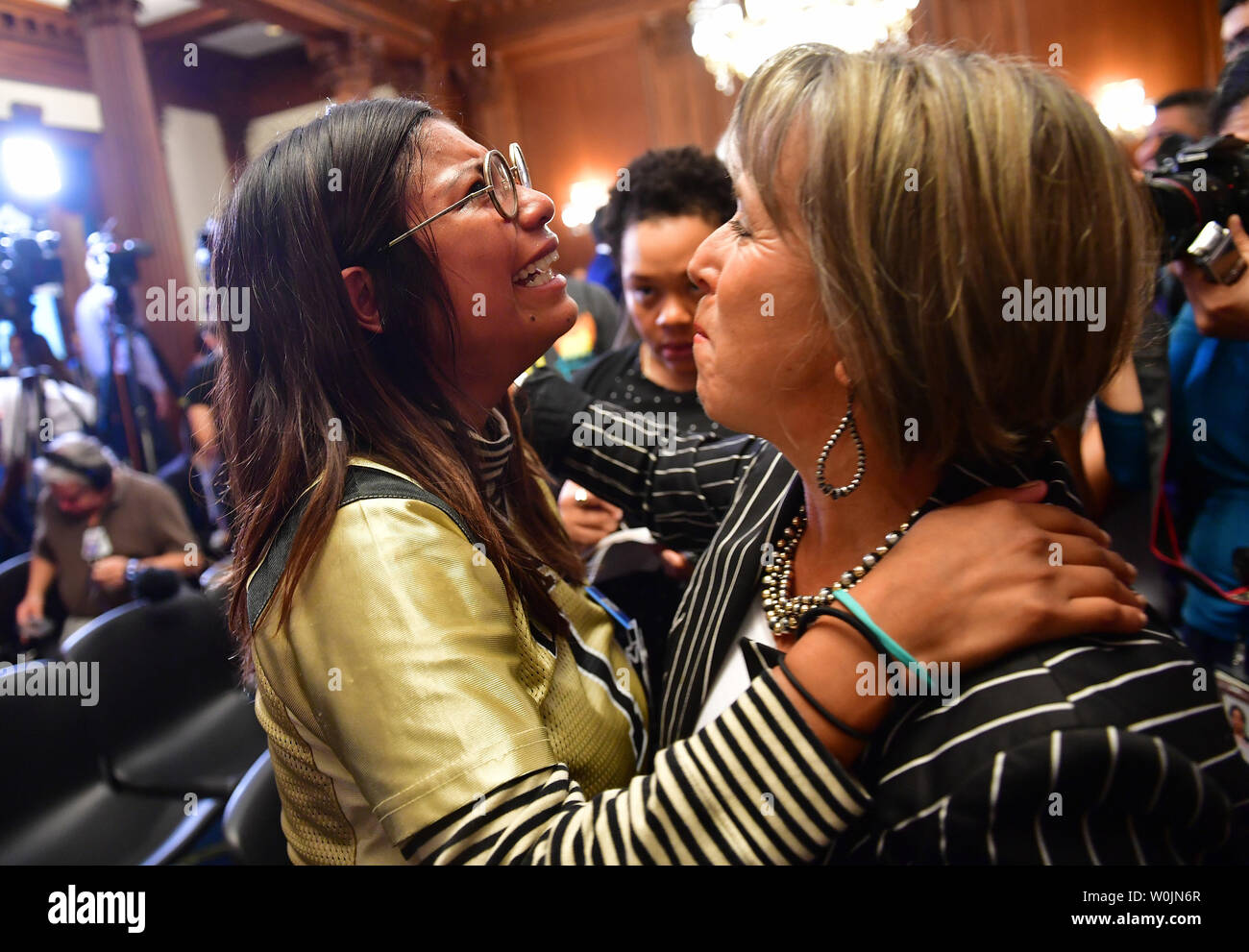 Rep. Michelle Lujan Grisham, D-NM, hugs Karen Caudillo, 21, a DACA recipient, during a Democratic press conference calling on Congressional Republicans to stop the wind down of the Deferred Action for Childhood Arrivals (DACA) initiative at the U.S. Caption in Washington, D.C. on September 6, 2017. Photo by Kevin Dietsch/UPI Stock Photo