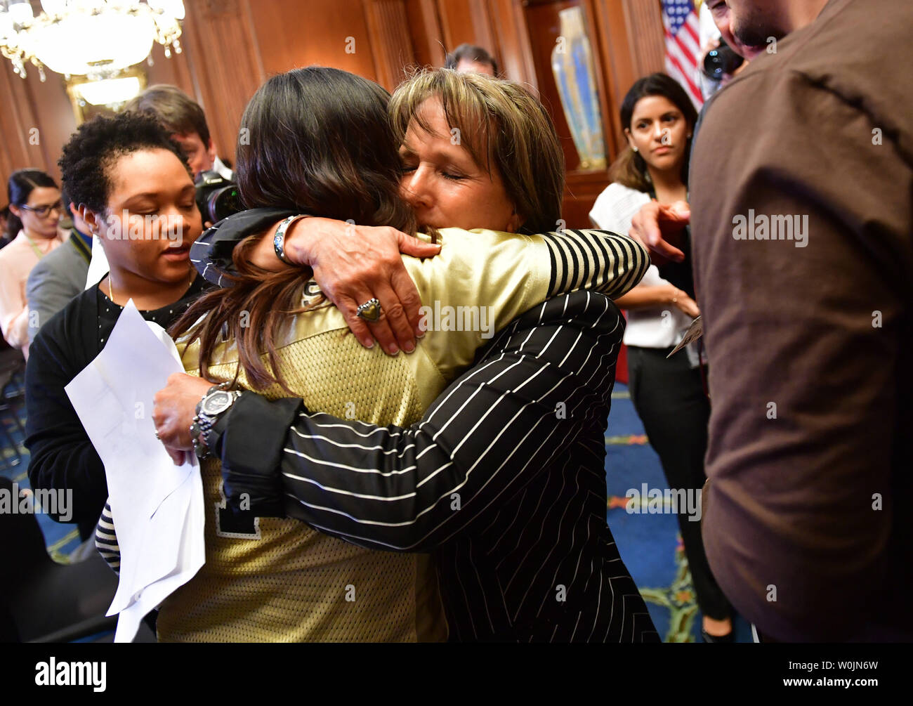 Rep. Michelle Lujan Grisham, D-NM, hugs Karen Caudillo, 21, a DACA recipient, during a Democratic press conference calling on Congressional Republicans to stop the wind down of the Deferred Action for Childhood Arrivals (DACA) initiative at the U.S. Caption in Washington, D.C. on September 6, 2017. Photo by Kevin Dietsch/UPI Stock Photo