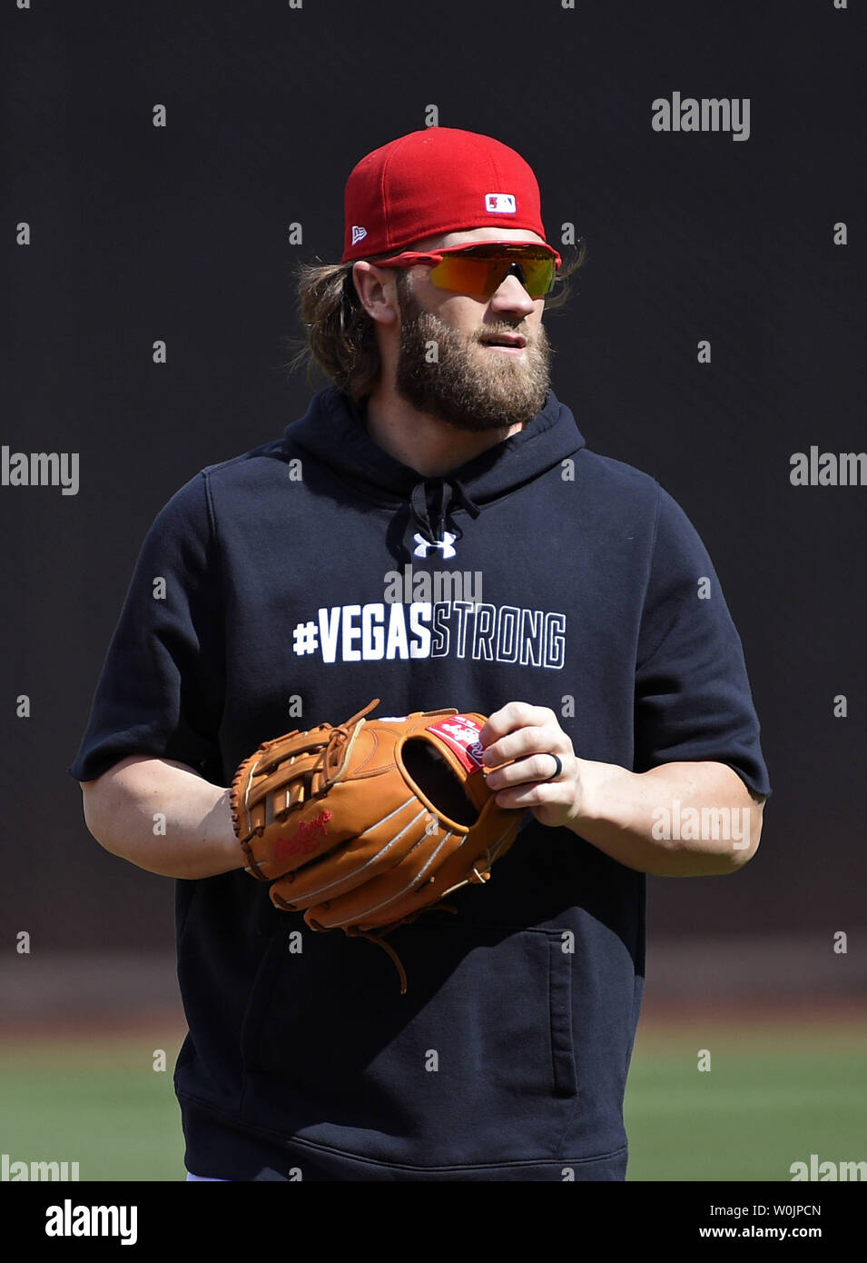 Washington Nationals Bryce Harper wears a shirt in honor of the shooting  victims in Las Vegas as he participates in practice a day before game 1 of  the NLDS at Nationals Park