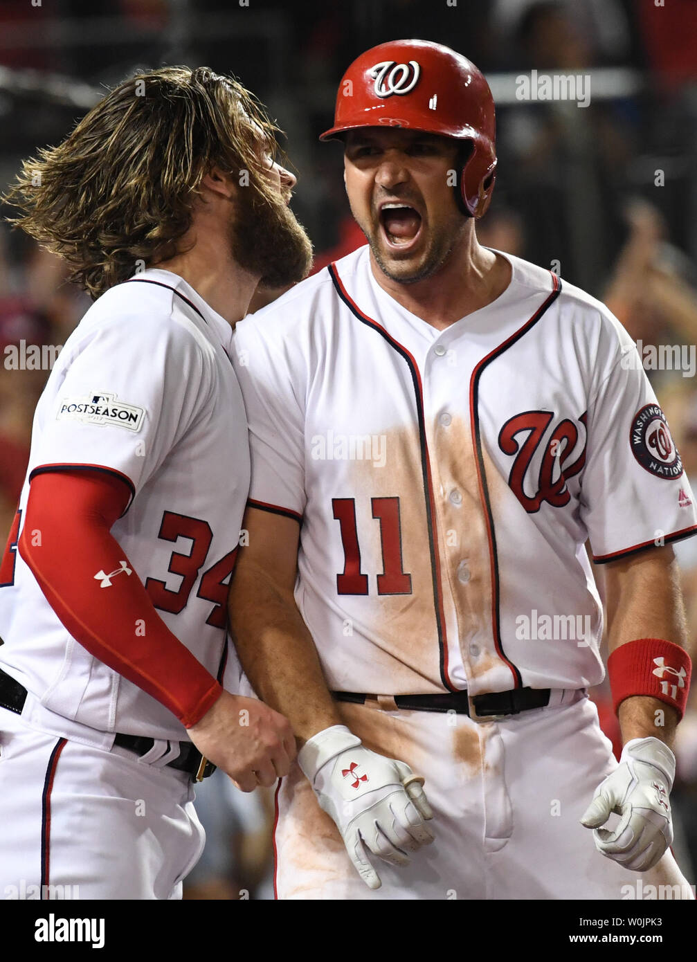 Washington Nationals Ryan Zimmerman (R) celebrates his three run, game  winning home run with Bryce Harper in the eighth inning against the Chicago  Cubs in game 2 of the NLDS at Nationals