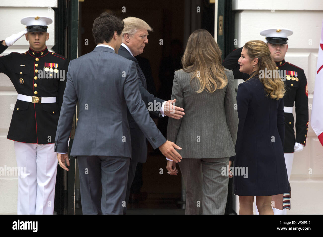 President Donald Trump (2nd-L), First Lady Melania Trump (2nd-R), Canadian  Prime Minister Justin Trudeau (L) and his wife Gregoire Trudeau arrive at  the White House in Washington, D.C. on October 11, 2017.