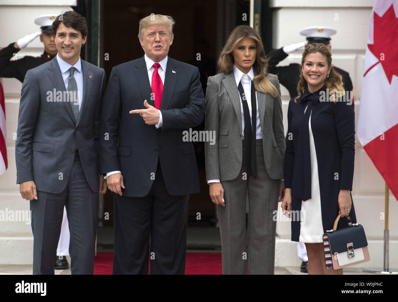 President Donald Trump (2nd-L) and First Lady Melania Trump (2nd-R) pose  with Canadian Prime Minister Justin Trudeau (L) and his wife Gregoire  Trudeau as they arrive at the White House in Washington,