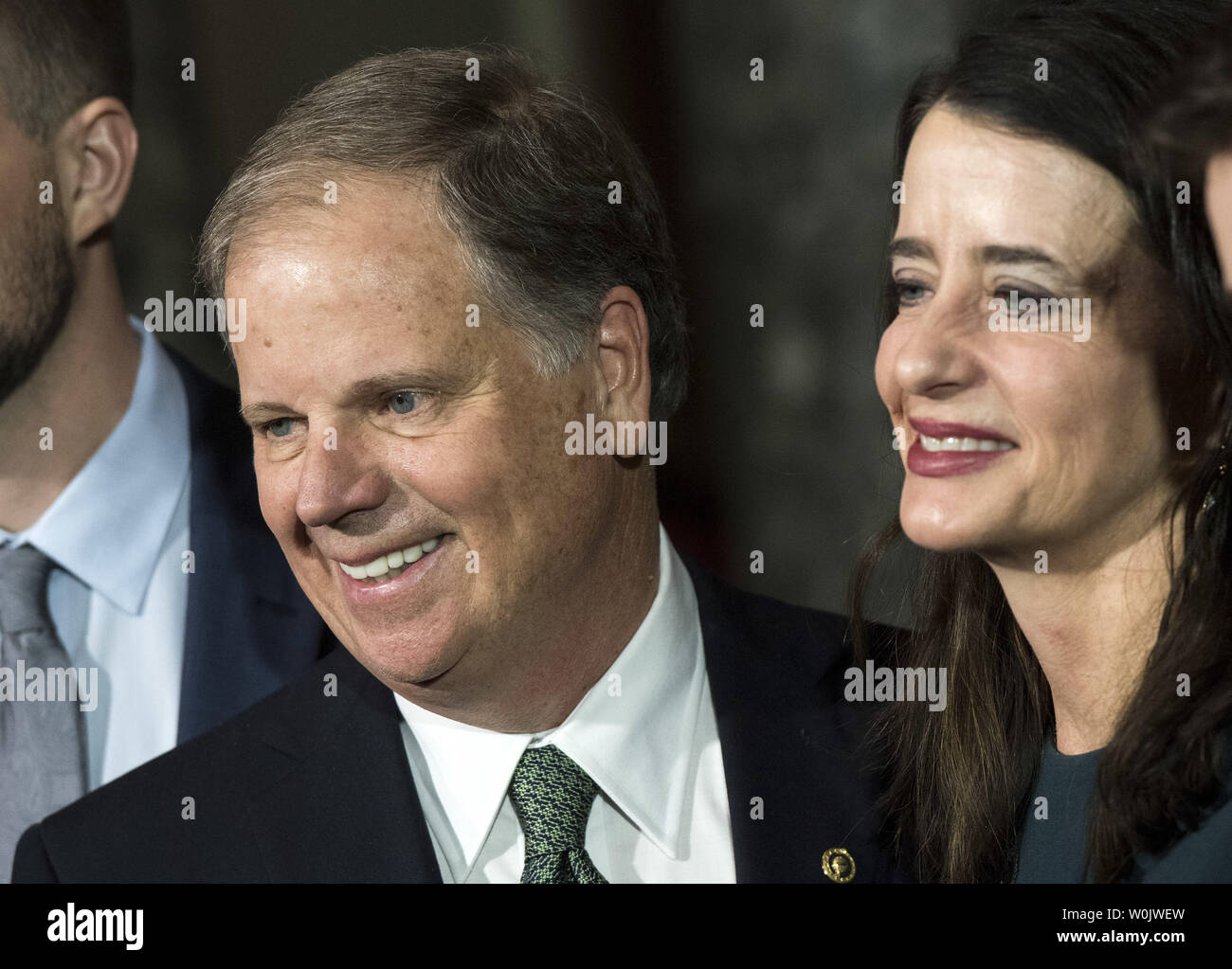 Newly elected Senator Doug Jones, D-AL, smiles alongside his wife Louise, after he was sworn in to the U.S. Senate, on Capitol Hill in Washington, D.C. on January 3, 2018. Photo by Kevin Dietsch/UPI Stock Photo
