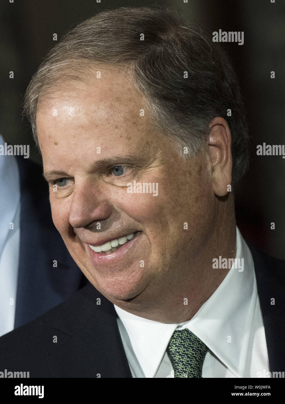 Newly elected Senator Doug Jones, D-AL, smiles after he was sworn in to the U.S. Senate, on Capitol Hill in Washington, D.C. on January 3, 2018. Photo by Kevin Dietsch/UPI Stock Photo