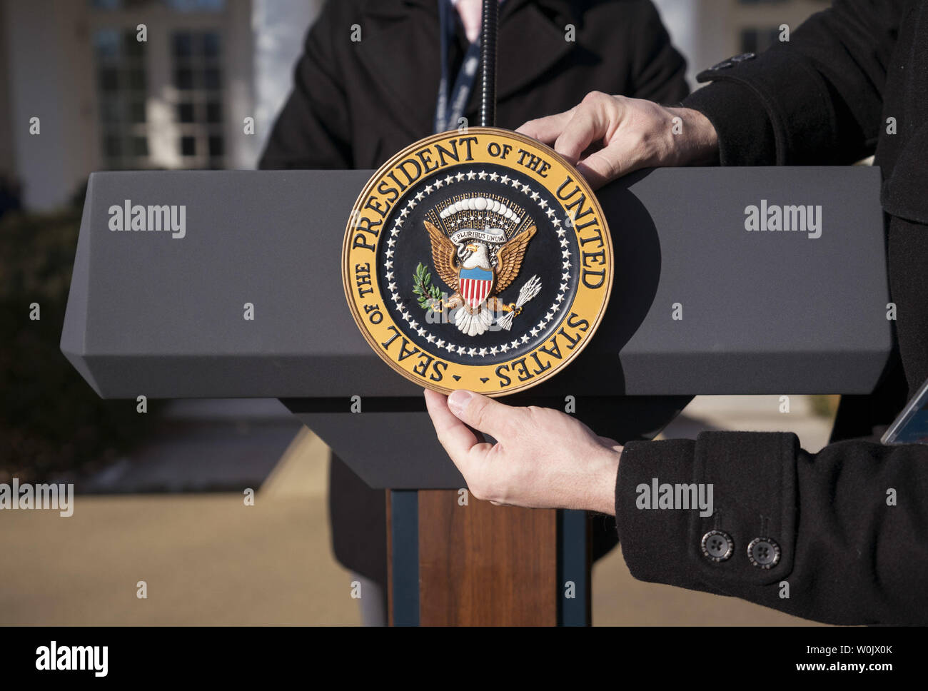 White House staff place the Presidential Seal on President Donald Trump's podium prior to an event where Trump addressed members of the March for Life event, at the White House in Washington, D.C. on January 19, 2018. Photo by Kevin Dietsch/UPI Stock Photo