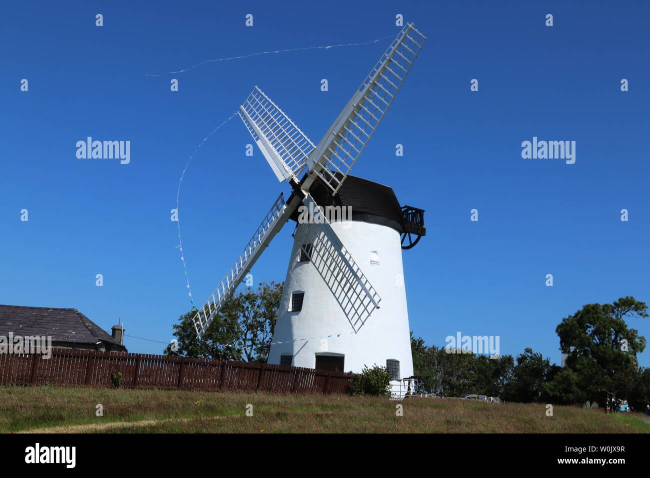 Melin Llynnon is a fully restored working windmill and café built in 1775 with iron-age roundhouses at Llanddeusant Anglesey Wales Stock Photo