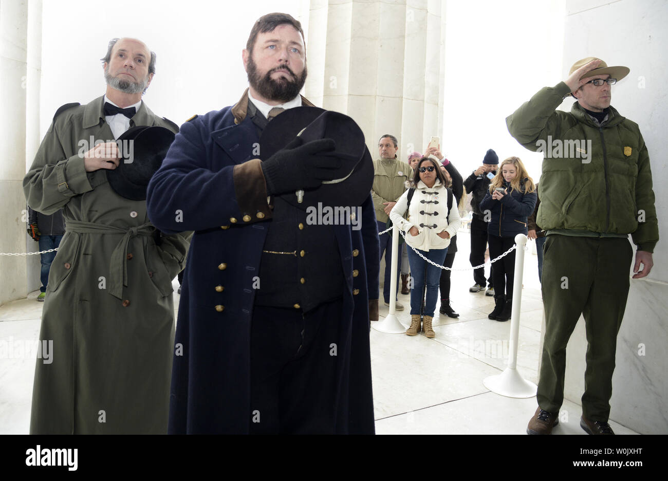 US President Abraham Lincoln re-enactor Greg Edwards (L) and Gen. Ulysses S. Grant re-enactor Kenneth Serfass pause during the Pledge of Allegiance during a National Park Service-hosted event to mark the 209th anniversary of Lincoln's birthday, February 12, 2018, at the Lincoln Memorial, in Washington, D.C. Considered one of America's greatest presidents, Lincoln is remembered for preserving the Union after the Civil War and freeing slaves with the Emancipation Proclamation.       Photo by Mike Theiler/UPI Stock Photo