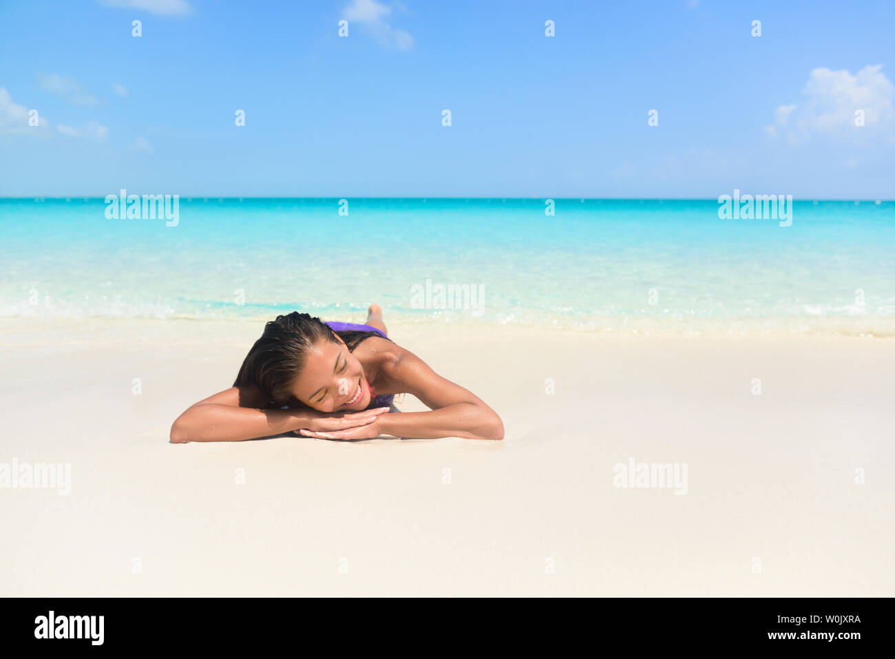 Relaxing Woman On Beach Vacation Sleeping On Sand Beautiful Girl Lying Down Under The Sun