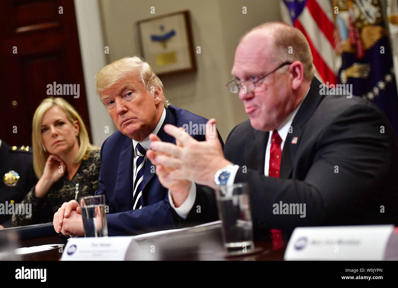 President Donald Trump (C) holds a law enforcement roundtable on sanctuary cities, in the Roosevelt Room at the White House on March 20, 2018 in Washington, D.C. Trump was joined by Homeland Security Secretary Kirstjen Nielsen (L) and Thomas Homan, acting director of Immigration and Customs Enforcement. Photo by Kevin Dietsch/UPI Stock Photo