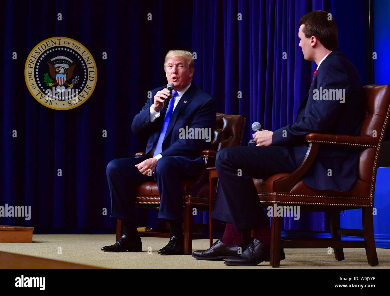 President Donald Trump participates in a question and answer session with Charlie Kirk, Director of Turning Point USA, during the Generation Next Summit at the Eisenhower Executive Office Building in Washington, D.C. on March 22, 2018. The summit brought together millennials and administration officials to discuss important policy issues including the economy and jobs and college campus issues. Photo by Kevin Dietsch/UPI Stock Photo