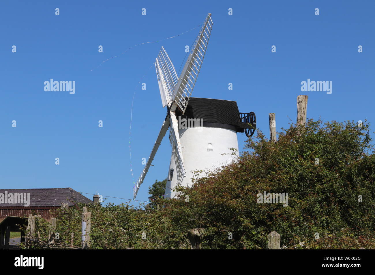 Melin Llynnon is a fully restored working windmill and café built in 1775 with iron-age roundhouses at Llanddeusant Anglesey Wales Stock Photo