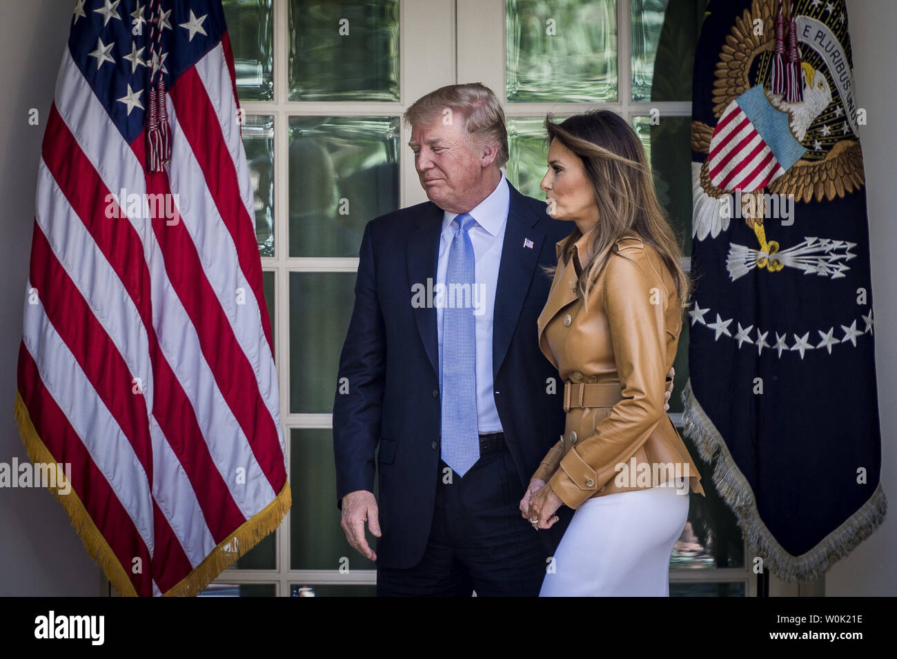 President Donald Trump and First Lady Melania Trump make their way to the  Oval Office following the First Lady's remarks announcing the launch of her  BE BEST initiative on May 7, 2018