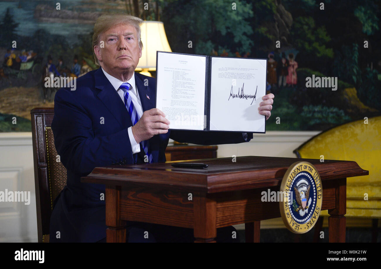 President Donald Trump holds up a National Security Presidential Memorandum that he signed after announcing his decision to end the United States participation in the Joint Comprehensive Plan of Action (JCPOA) with Iran and his plans re-impose sanctions lifted under the deal in the Diplomatic Room of the White House in Washington, D.C on May 8, 2018. Photo by Leigh Vogel/UPI Stock Photo