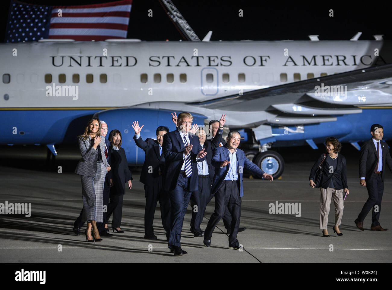 President Donald Trump walks on the tarmac with the three American citizens Kim Hak-Song, Kim Dong-Chul, and Kim Sang-Duk, who were detained in North Korea, at Joint Base Andrews in Maryland on May 10, 2018. Photo by Leigh Vogel/UPI Stock Photo