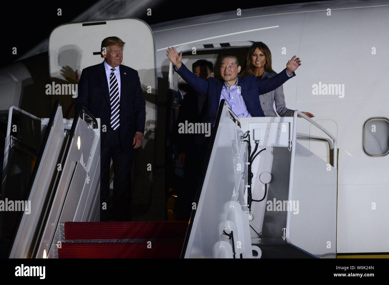 President Donald Trump looks on as US detainee Kim Dong-chul raises his arms upon his return to the United States with Kim Hak-song and Tony Kim after they were released by North Korea, at Joint Base Andrews in Maryland on May 10, 2018. Photo by Leigh Vogel/UPI Stock Photo