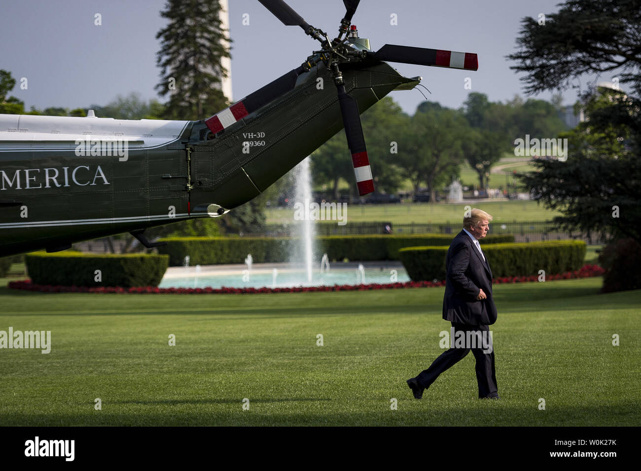 President Donald Trump makes his way from Marine One on the South Lawn to the Oval Office of the White House on May 15, 2018 in Washington, D.C. Trump was returning from Walter Reed Medical Center where he visited with First Lady Melania Trump who is convalescing following a kidney procedure yesterday. The First Lady's office has reported "the First Lady remains in good spirits.”    Photo by Pete Marovich/UPI Stock Photo
