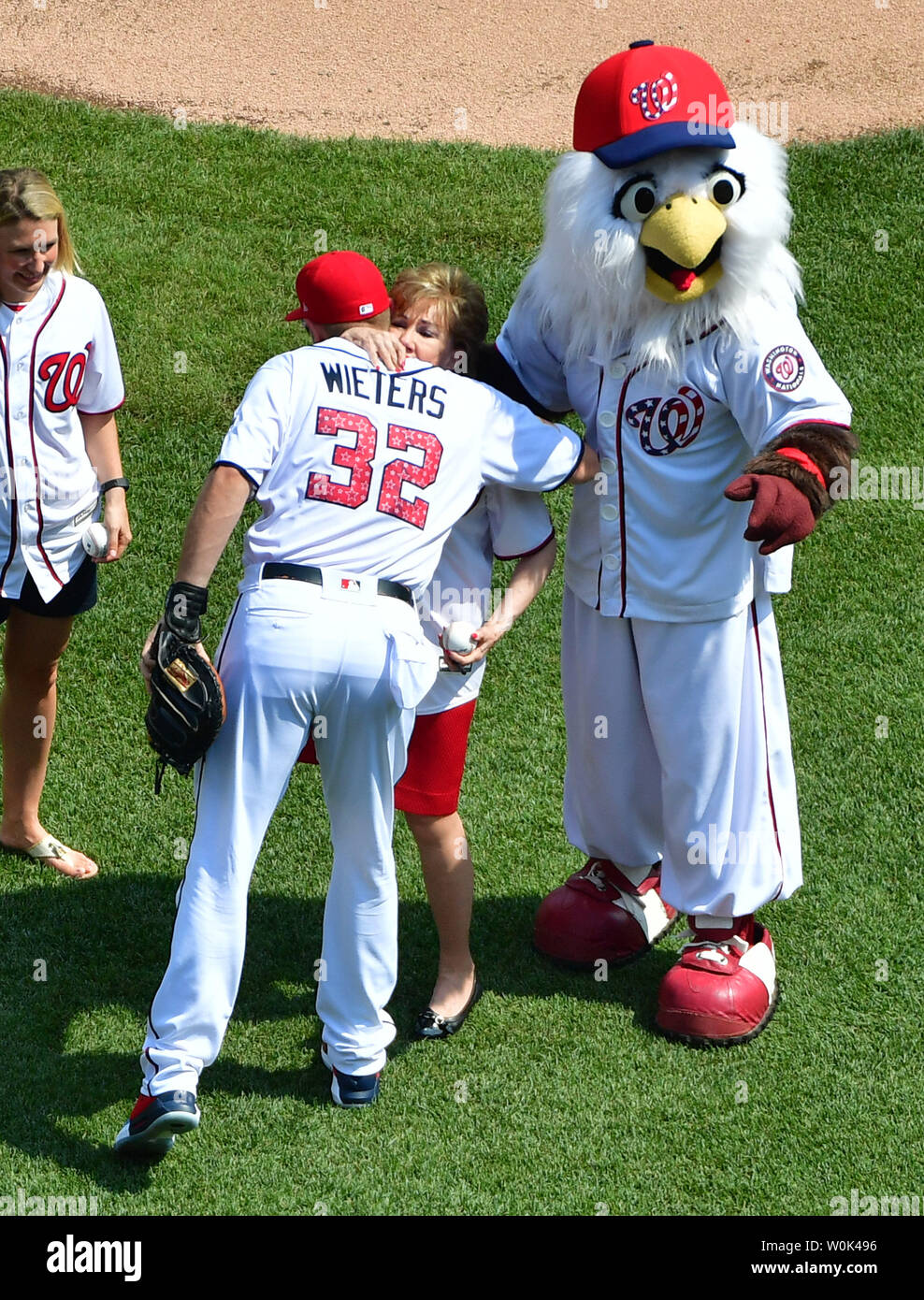 Former Senator and two-time Cabinet Member Elizabeth Dole hugs Washington Nationals' Matt Weiters during pre game festivities on Independence Day prior to the Washington Nationals game against the Boston Red Sox, at Nationals Park in Washington, D.C. on July 4, 2018.  Photo by Kevin Dietsch/UPI Stock Photo