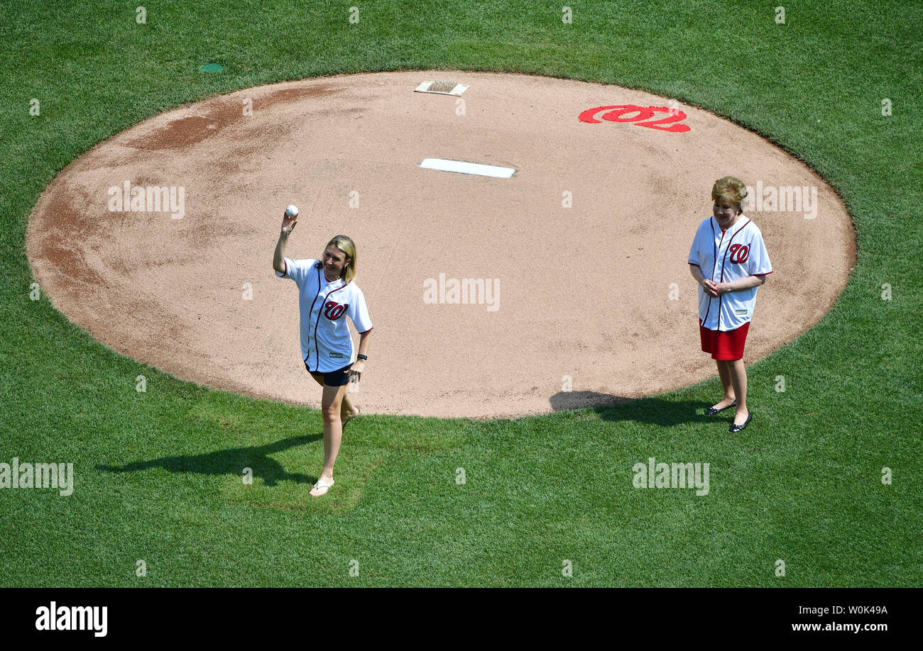 Former Senator and two-time Cabinet Member Elizabeth Dole (R) watches as Megan Turner twos out the first pitch on Independence Day prior to the Washington Nationals game against the Boston Red Sox, at Nationals Park in Washington, D.C. on July 4, 2018.  Photo by Kevin Dietsch/UPI Stock Photo