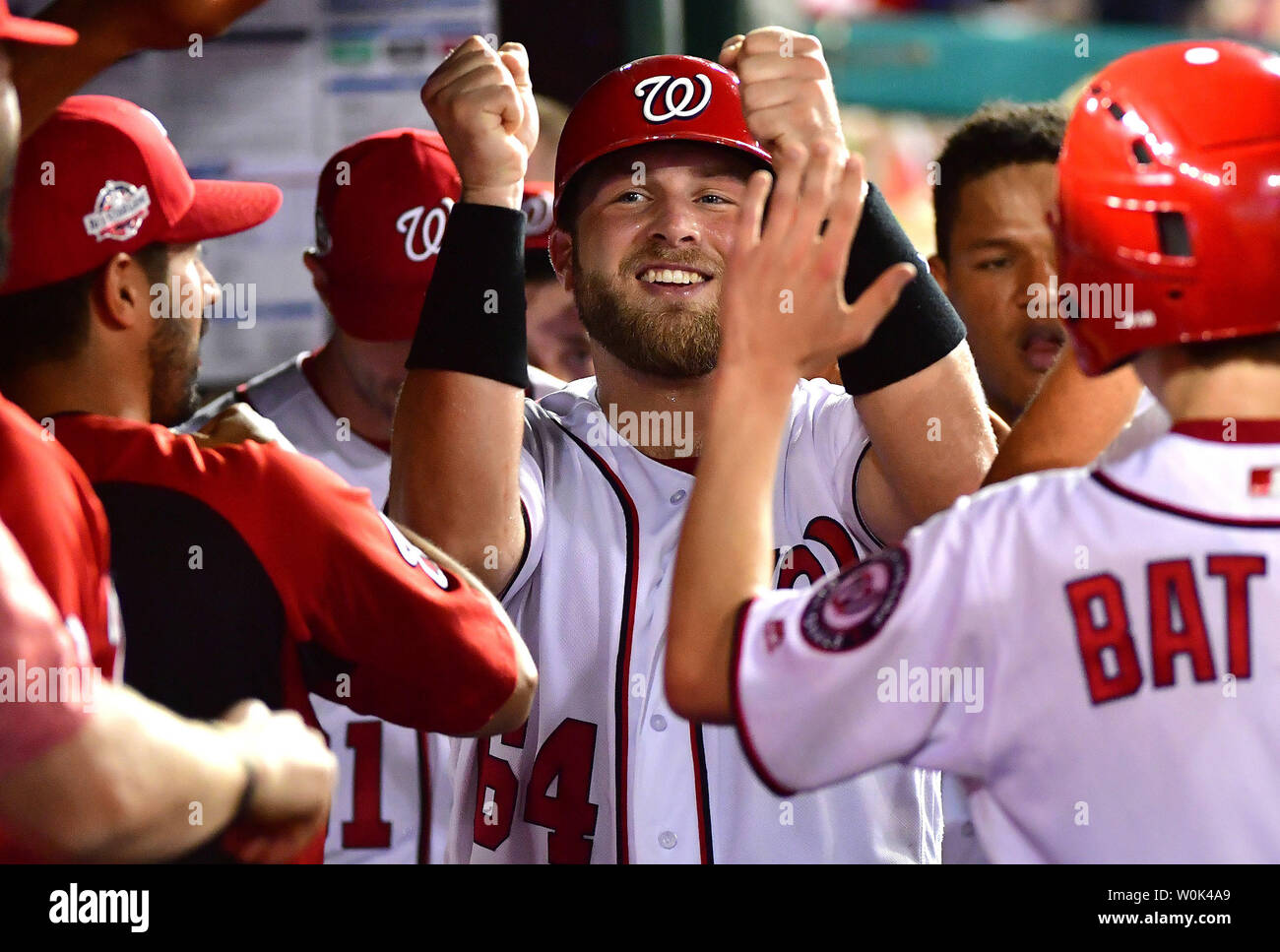 Washington Nationals catcher Spencer Kieboom celebrates in the dugout after scoring off of a single from Trea Turner against the Miami Marlins in the seventh inning at Nationals Park in Washington, D.C. on July 5, 2018. The Washington Nationals defeated the Miami Marlins 14-12. Photo by Kevin Dietsch/UPI Stock Photo